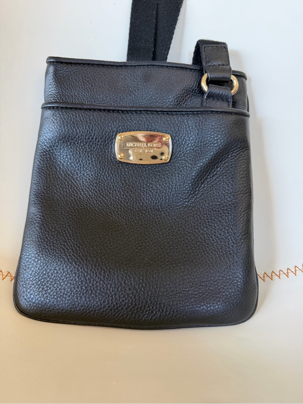 Michael Kors Black Pebbled Leather Crossbody with Gold Plaque